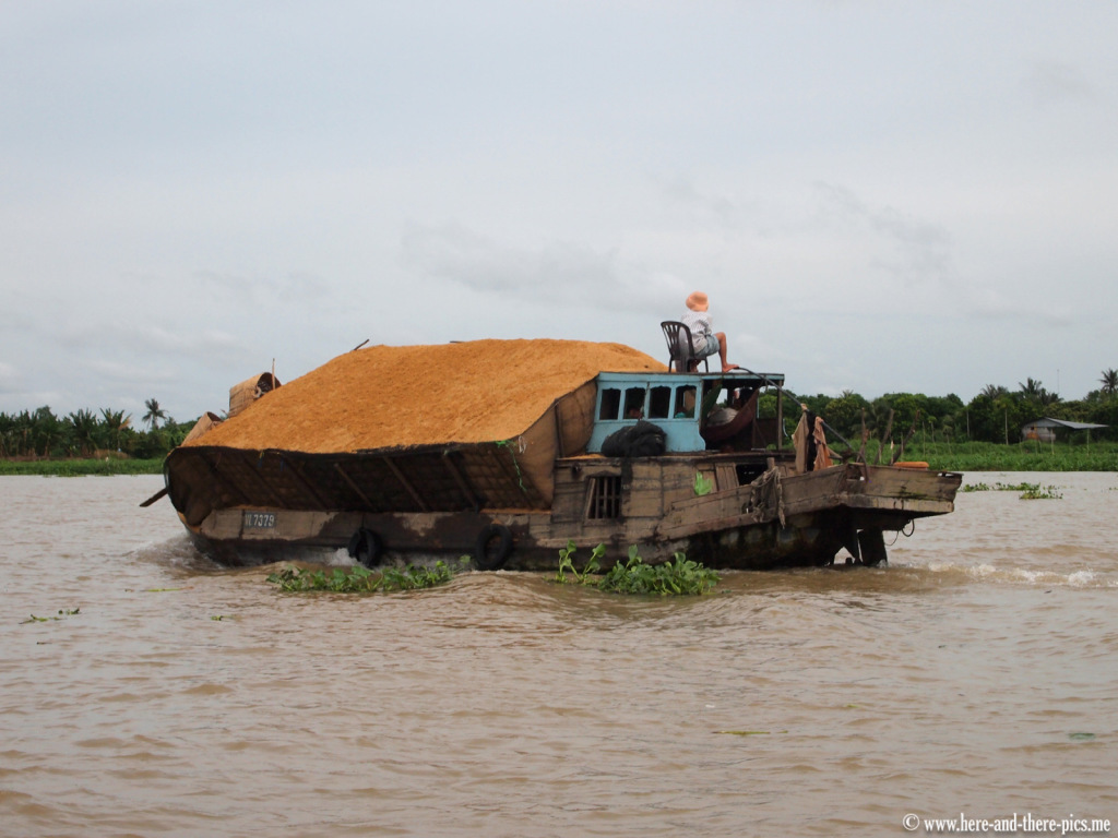  Rice husk on a boad on the Mekong,; Vietnam